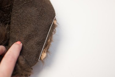 Place the ear in the slit.