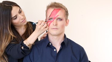Lining lightning bolt with blue eyeliner