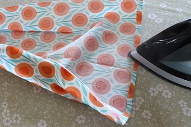 Press the side edges of the waistband under