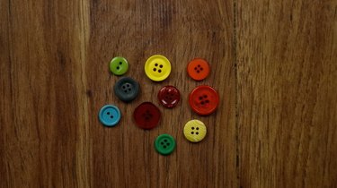 Assorted colors and sizes of buttons for Christmas ornament gift tags