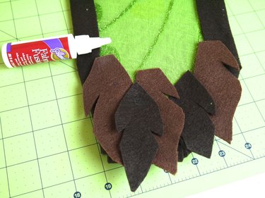 Bottom tip of wing with 5 overlapping feathers glued in place.