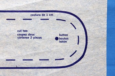 Close up of a button placement mark on a pattern.