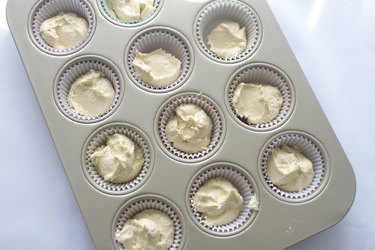Batter poured into cupcake liners