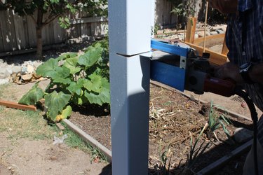 Using a circular saw to cut posts.