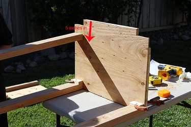 Attaching the legs to the dehydrator box.
