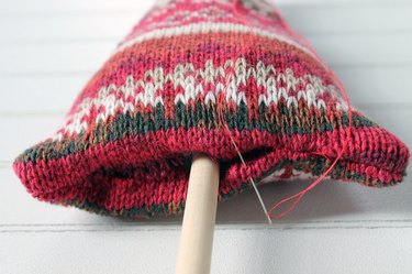 insert the wooden dowel and sew the opening closed