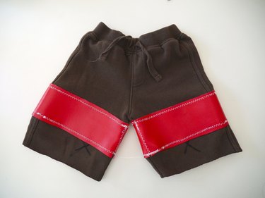 original knee pieces sewn to the vinyl pieces on the thighs
