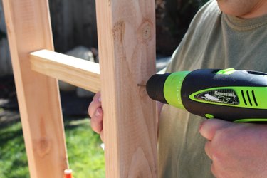 Using a drill bit on the legs before using a screw.