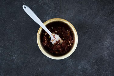 Combining ingredients for paste in a bowl
