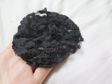 Placing another piece of cut lace on top of the wire ear.