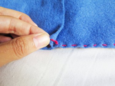 The knotted thread on the DIY felt pencil case