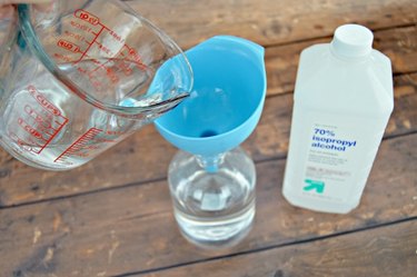 Add isopropyl alcohol to the spray bottle.
