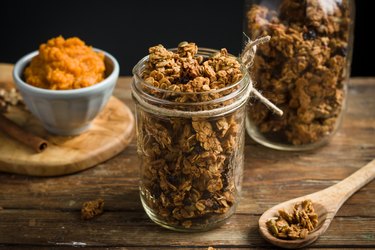 Homemade pumpkin spice granola in mason jars.