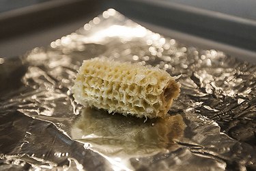 Cook and eat the corn, leaving the bare cob exposed.