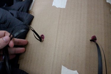thread the rope/string through the holes