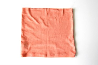 Turn the bottom of your tank top into a belt