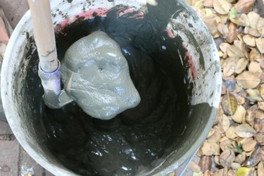 Mixing concrete with a 1:2 water to mix ratio