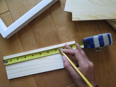 Take your measurement and mark it on the wood board.