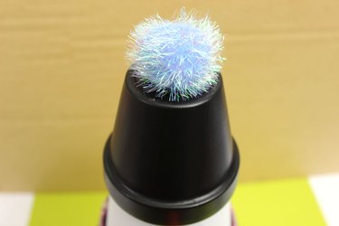 pom pom on top of clay pot snowman's hat