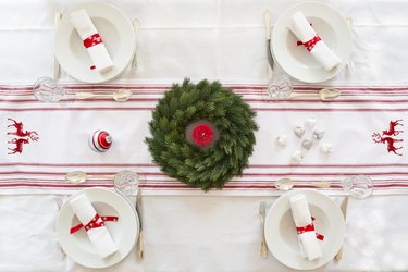 Table with Advent wreath and red-and-white tablecloth