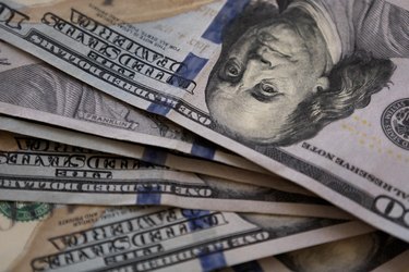 full frame of spread of crisp $100 bills