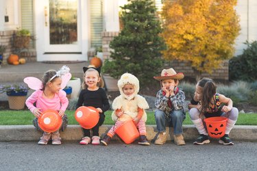 Multiethnic group of kids trick or treating