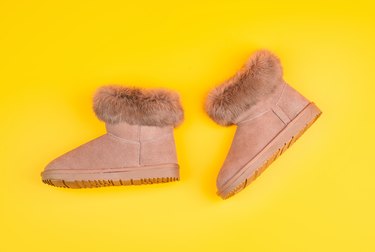 Stylish leather footwear against yellow background