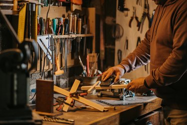 Religious carpenter in work shop