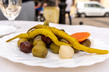 Vegetables in brine on white plate