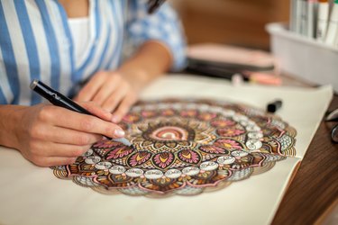 High Angle View Of Woman Holding Hands On Table