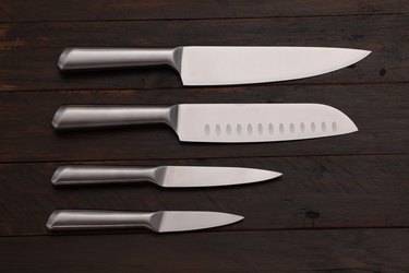 Four stainless steel kitchen knives