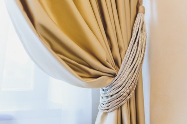 Holder for room curtains. Fragment photo curtain, interior detail, curtain detail close up.