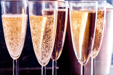 Full champagne glasses on a table