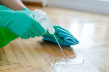 Spraying floor while cleaning