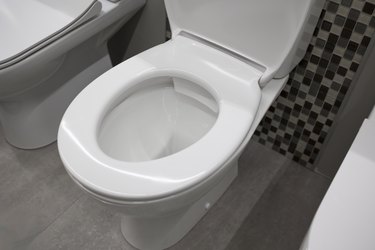 New ceramic toilet bowl close up view . Construction store