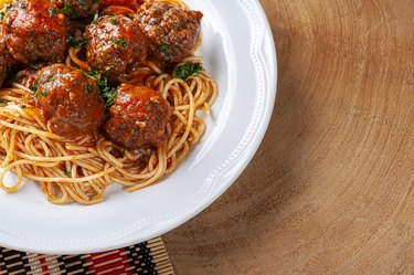 Meatballs with tomato sauce and pasta. Top view - Almondegas.
