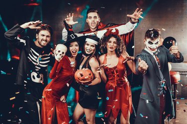 Portrait of Young Smiling People in Scary Costumes