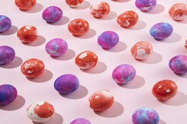 Colorful Easter Eggs in a Row on Pink Background