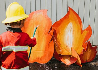 Child Plays Firefighter Role Play Game