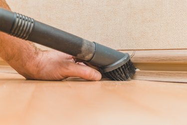 Vacuuming along baseboard