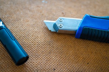 cutter knife on wooden surface