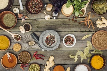 Mortar and pestle with spices on a table