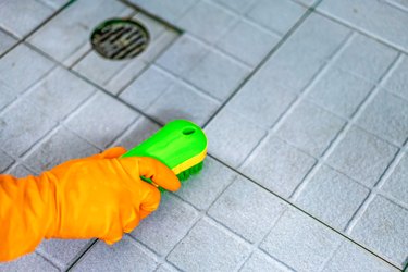 Cleaning floor tiles in shower