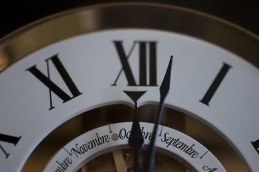 Vintage grandfather clock at 12 o'clock roman numerals