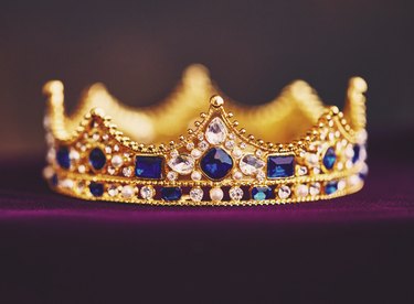 Gold jeweled crown on velvet