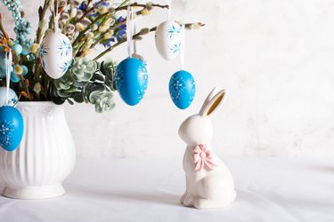 Easter table setting, painted eggs. Easter willow in a vase greeting card