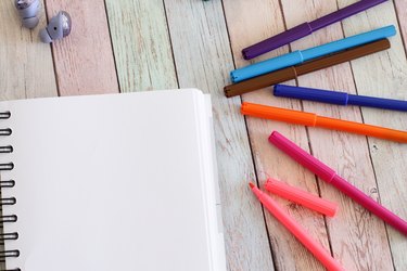 Notebook blank page and colorful felt-tip pens