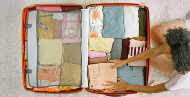 Woman packing clothes