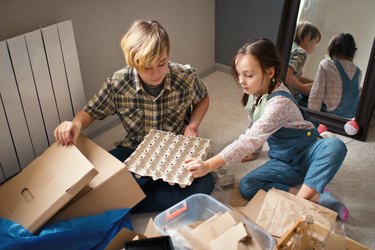 Family sorting out waste for recycling