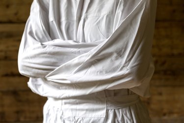 Woman with straitjacket, dark background